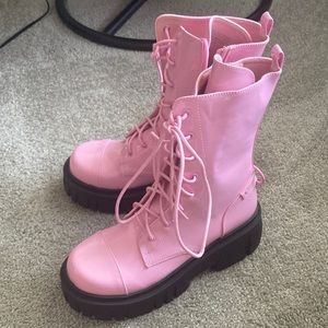 Dolls kill pink patent leather platform boots.